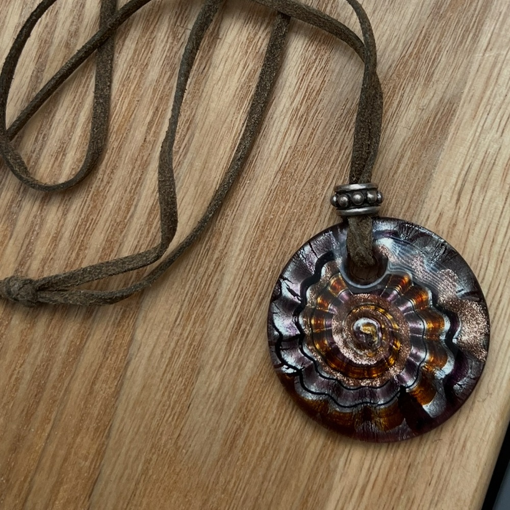 Long necklace with large pendant and sterling silver charm